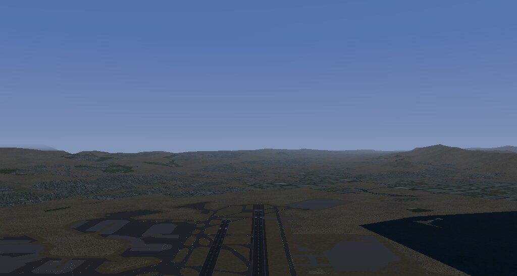 The finished scenery in FlightGear: KSFO's runways in the
foreground, the peninsula and hills beyond.