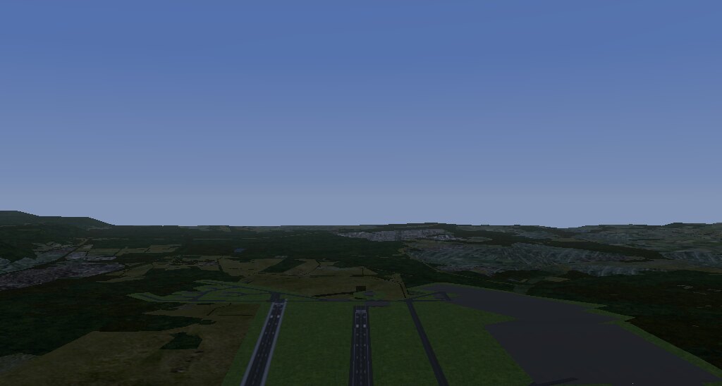 A runway in Rheinland-Pfalz seen from the air: wooded hills on
every side and farmland in place of a coastline.